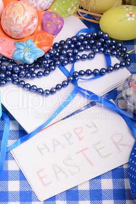 Easter eggs and invitation note. happy easter