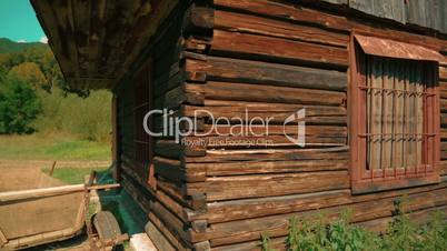 Wide Shot of an Abandoned Log House