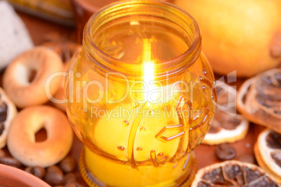 Coffee beans on a black background with candle. Raw coffee beans and fire from candle
