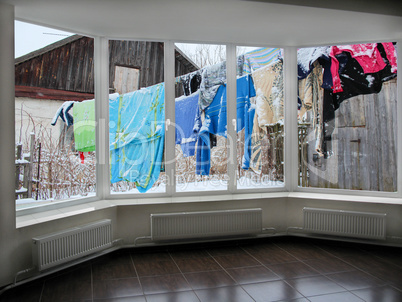 windows with view of washing suspended on a cord