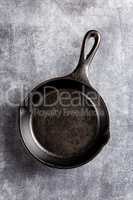 cast iron pan on dark background