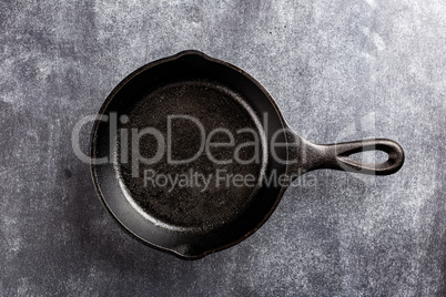 cast iron pan on dark background