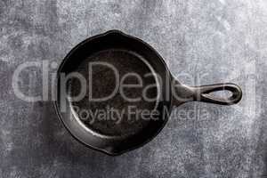 cast iron pan on dark background