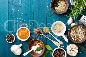 culinary background with spices on wooden table