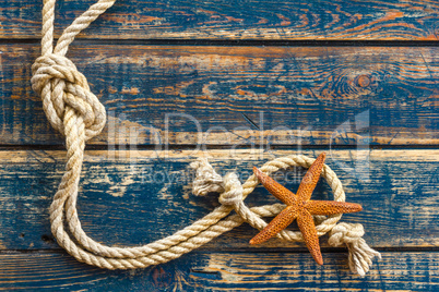 Sea background with starfish and marine rope