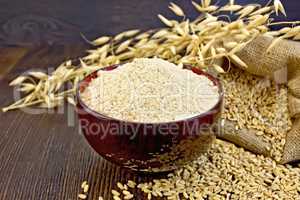 Flour oat in bowl on board