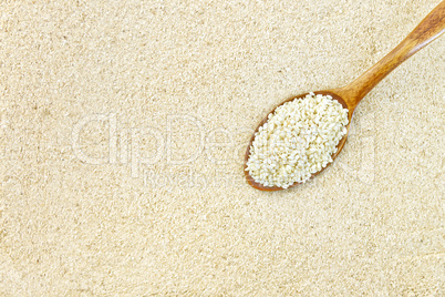 Flour sesame with seeds in spoon