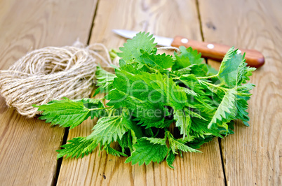 Nettle with a knife and twine on board