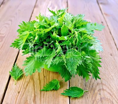 Nettles in a green bowl on board