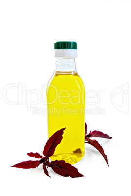 Oil with amaranth in bottle