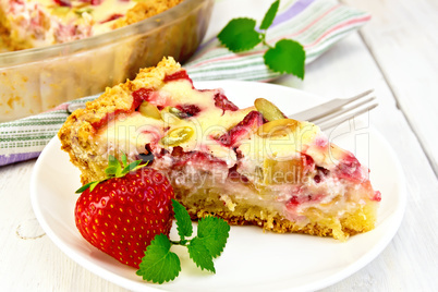 Pie strawberry-rhubarb with sour cream in white plate