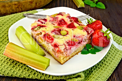 Pie strawberry-rhubarb with sour cream on green napkin