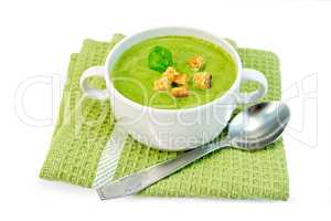 Soup puree with spinach and napkin