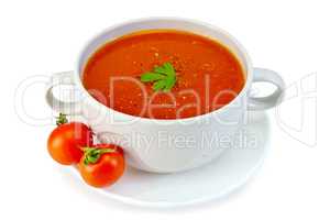 Soup tomato in white bowl with tomatoes