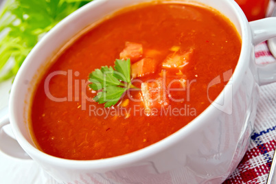 Soup tomato on napkin with parsley