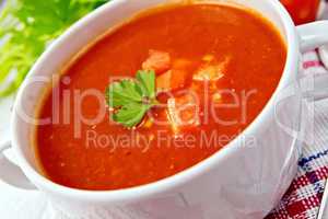 Soup tomato on napkin with parsley