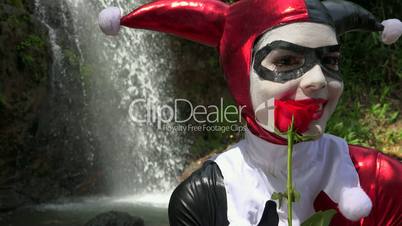 Female Cosplay Jester With Red Rose