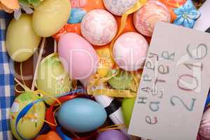 Easter background with eggs, ribbons and spring decoration