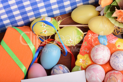 Easter background with colorful eggs and gift box