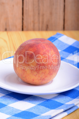 fresh peach on white plate