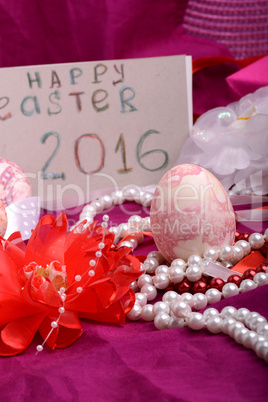 Easter eggs and flowers on background with gift box