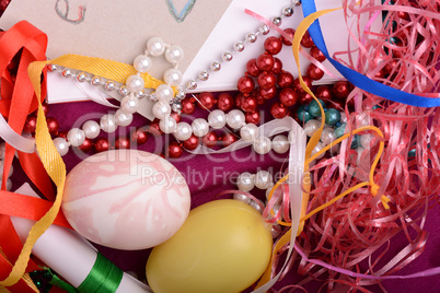 Easter background with eggs, ribbons and spring decoration