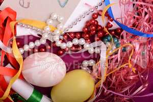 Easter background with eggs, ribbons and spring decoration