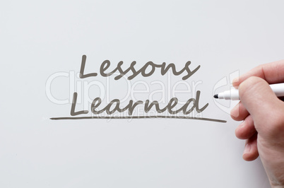 Lessons learned written on whiteboard