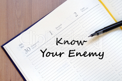 Know your enemy write on notebook