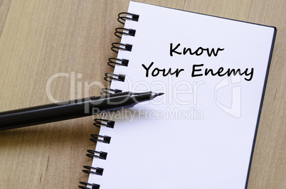 Know your enemy write on notebook