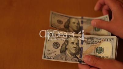 Female hand holding dollars isolated on white background