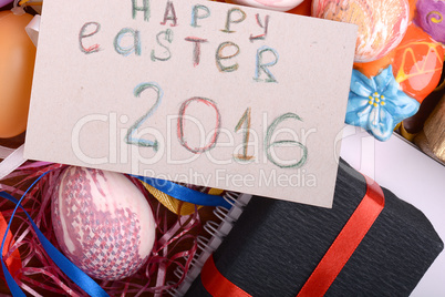 Easter background with eggs, ribbons and spring decoration