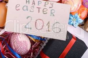 Easter background with eggs, ribbons and spring decoration