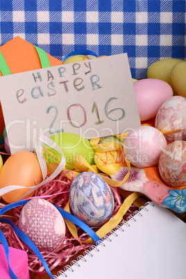 Easter background with eggs, ribbons and spring decoration