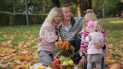 Happy family having fun outdoors in spring park