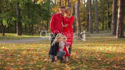 Happy family having fun outdoors in park