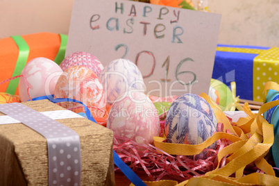 Easter background with eggs, ribbons and spring decoration