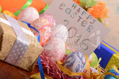 Easter background with eggs, ribbons and spring decoration