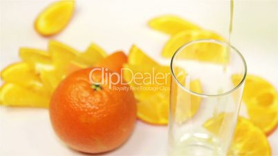 orange and orange juice on the table, close-up