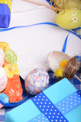 Assorted Easter coloured eggs in the paper egg box