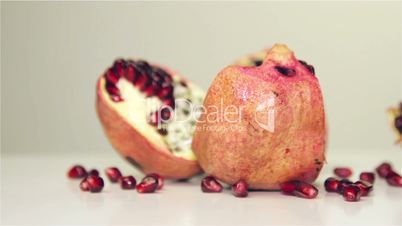 Rotating Pomegranate on the white table