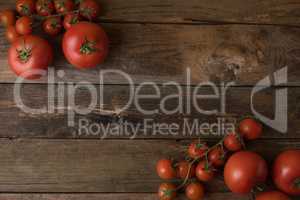 Fresh, ripe tomatoes on an old wooden board.tomatoes background