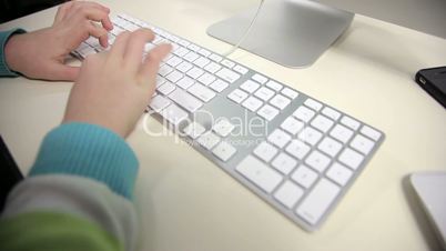 girl is typing on her computer, office work, business