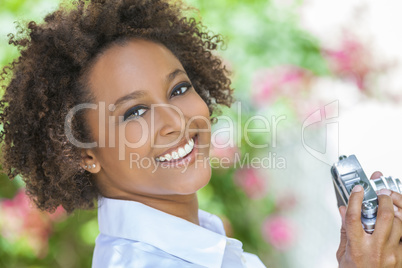 Mixed Race African American Girl Outside With Camera