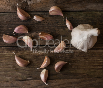 Garlic on wood background.