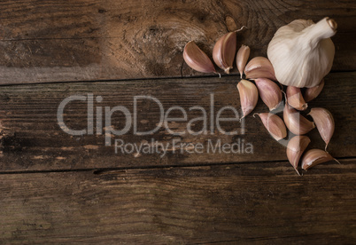 Garlic on wood background.