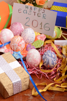 Easter background with eggs, ribbons and spring decoration