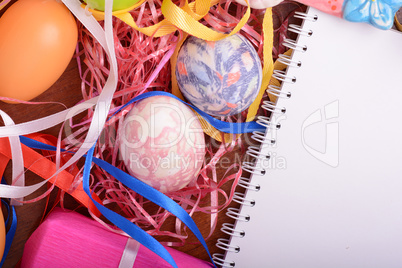 Easter background with eggs, ribbons and spring decoration