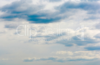 blue sky background with tiny clouds