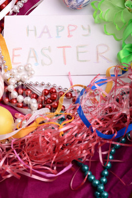 Easter background with eggs, ribbons and spring decoration